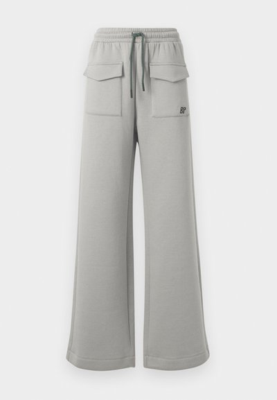 Light grey wide-leg sweatpants with an elastic waistband, green drawstring, and two front patch pockets. Features "BP" logo in black.