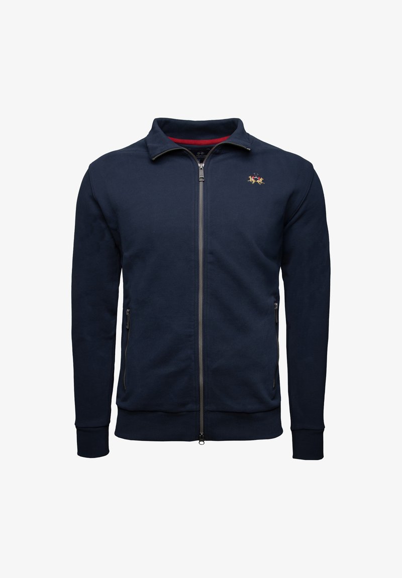 Navy zip-up jacket made of soft fabric, featuring a high collar, two front pockets, and an embroidered logo on the chest.