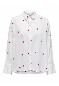 Valkoinen pitkähiha paita, jossa punainen sydämen kirjailu. Kirjaukset sisältävät napillisen kauluksen, etumustan napituslistan ja kalvosimet, joissa on hieman kaareva helma.