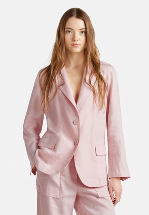 Light pink linen blazer with two front pockets, notched lapels, and two buttons, featuring a relaxed fit and slightly textured surface.
