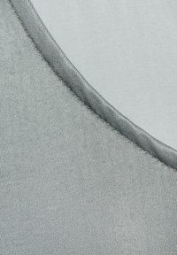 Gray fabric with a smooth texture and a slight sheen, featuring a rounded neckline with a contrasting stitched edge.