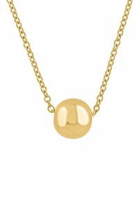 Auksinio tono vėrinys su lygiu, apvaliu pakabuku ant grandinėlės, pasižymintis blizgiu, atspindinčiu paviršiumi.