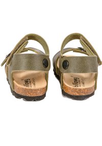 Sandales vertes avec un dessus texturé, des sangles réglables avec des boutons noirs et une semelle intérieure en liège, complètes avec une semelle en caoutchouc noir texturé.