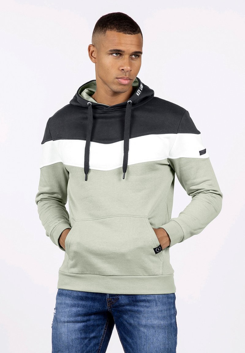 Sudadera con capucha de diseño a bloques de color; negro, blanco y verde oliva. Fabricada en tejido suave, con un bolsillo frontal y capucha con cordón.