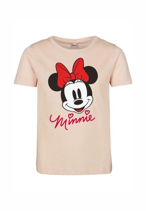 T-shirt en coton rose clair avec un motif graphique d'une tête de souris souriante portant un nœud rouge, avec "Minnie" écrit en rouge en dessous. Manches courtes.
