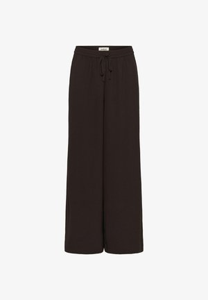 Tummanruskeat leveälahkeiset housut, jotka on valmistettu pehmeästä kankaasta. Housuissa on joustava vyötärö ja säädettävä kiristysnauha, ja niissä on sileä pinta.