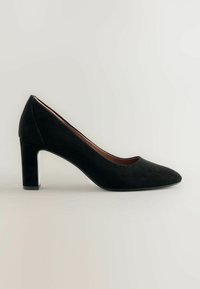 Black suede high heel pump with a pointed toe, a sturdy block heel, and a smooth inner lining. The design features a classic silhouette.