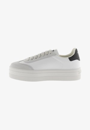 White sneaker with gray suede accents, round toe, thick white sole, and six eyelets for laces. Minimalistic design with logo detail on heel.