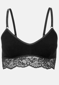 Bralette nera con spalline regolabili. Tessuto morbido sulla parte superiore e un bordo in pizzo lungo il fondo con motivi floreali.