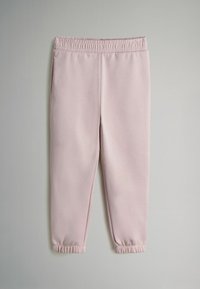 Šviesiai rožiniai treningai su elastinga juosta, sutrauktais kulkšniais ir šoninėmis kišenėmis. Pagaminti iš minkštos medžiagos su lygiu paviršiumi.