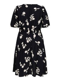 Robe noire avec imprimé floral blanc, manches courtes bouffantes, taille froncée et jupe évasée, vue de dos.