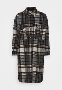 Cappotto lungo in plaid di lana nei toni del grigio, nero e marrone con chiusura a bottoni, due tasche sul petto e un colletto classico.