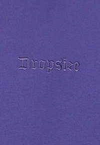 Purple fabric featuring the embroidered text "Dropsize" in a Gothic font. The texture is smooth with a slight sheen.