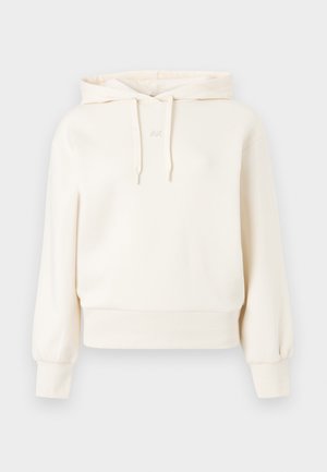 Kremfarget hettegenser med kengurulomme, snøring i hette, ribbede mansjetter og nedre kant. Har et subtilt "AX"-logo på brystet. Myk stoffsammensetning.