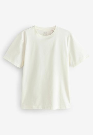 Kremasta pamučna majica s okruglim izrezom i kratkim rukavima. Jednostavan dizajn, lagana tekstura i ležeran kroj. Bez uzoraka ili naglasaka.