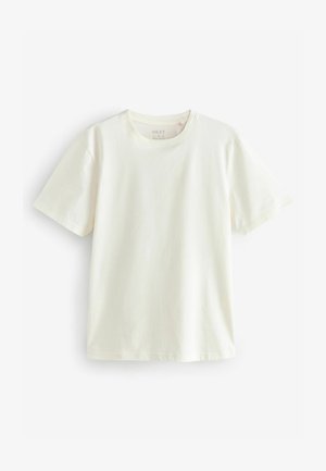 Kremasta pamučna majica s okruglim izrezom i kratkim rukavima. Jednostavan dizajn, lagana tekstura i ležeran kroj. Bez uzoraka ili naglasaka.