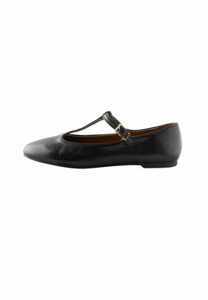 Black leather Mary Jane flat shoe with a rounded toe, strap across the foot, gold-tone buckle, and low, flat sole. Smooth texture.