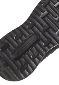 Schwarze Sneaker-Sohle mit strukturiertem Muster. Verfügt über eingelassene Bereiche und ein ausgeprägtes Dämpfungsdesign. Material wirkt robust und flexibel.