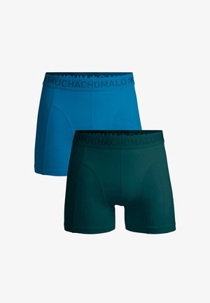 Pánske boxerky v modrej a tmavozelenej farbe, so soft elastickým pásom s brandingom "MUCHACHO MALO". Hladká tkanina a priliehavý strih.
