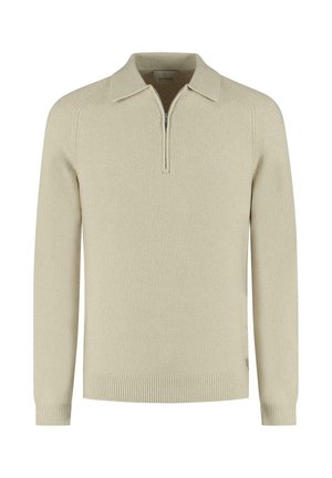 Pull en tricot beige avec un col zippé, des manches longues et des bords côtelés. Tissu texturé avec une coupe décontractée.
