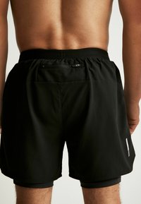 Next 2-IN-1 TRAINING - Shorts - black