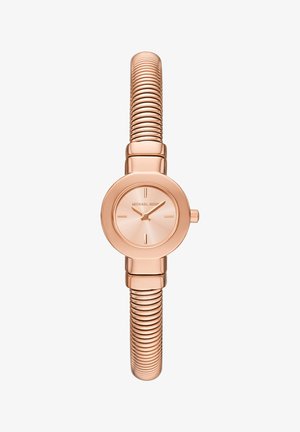 Montre analogique en or rose avec un boîtier rond, un cadran minimaliste et un bracelet en métal flexible et nervuré pour un ajustement réglable.