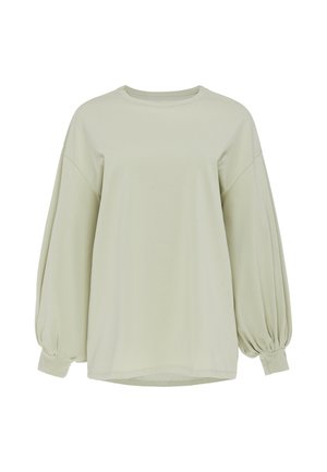 Langærmet lyse beige skjorte med puffede ærmer og ribkanten, med rund halsudskæring og løs pasform.