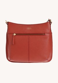 Sac en cuir rouille à bandoulière avec une poche zippée dorée et un subtil logo "LOXWOOD" embossé au-dessus de la fermeture éclair.