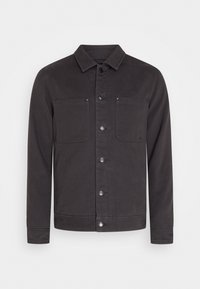 Sort skjortejakke lavet af holdbart stof, med spids krave, to brystlommer og knaplukning med trykknapper. Glat tekstur.