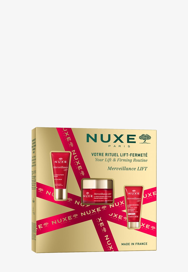 NUXE hudvårdsgåvoset i en guldask innehåller tre röda tuber och en kruka, märkta "Merveillance LIFT", dekorerad med ett rosa ribbonsmönster.