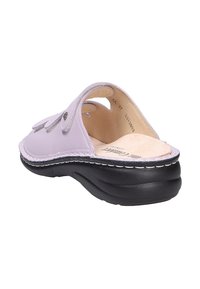 Lavender open-back slip-on sandal with adjustable straps, beige cushioned insole, and thick black sole designed for comfort.