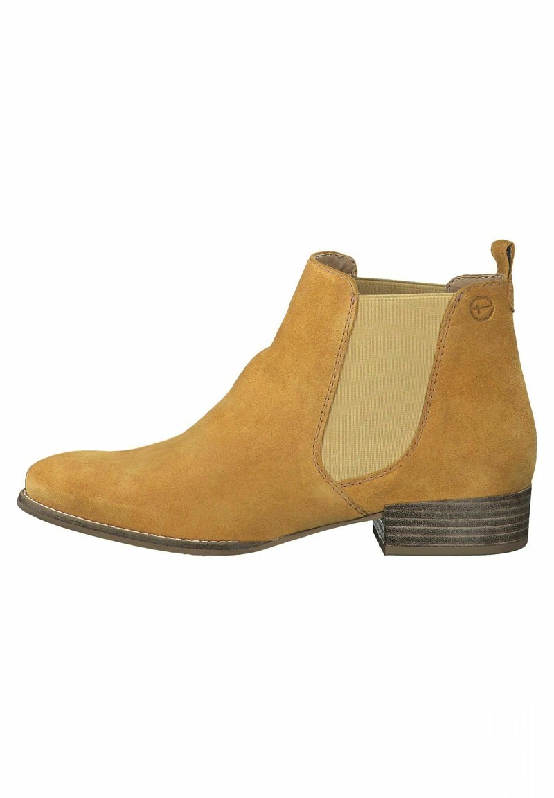 Botte Chelsea en daim couleur tan avec panneaux latéraux élastiques, talon bas empilé et languette à l'arrière.