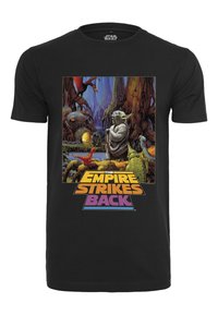 T-shirt en coton noir présentant un graphique coloré de Yoda, de droïdes et de créatures de "L'Empire contre-attaque" avec du texte en gras.