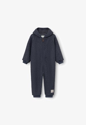 Marineblauwe fleece jumpsuit met een capuchon, voorzien van een rits aan de voorkant en ribbelboorden. Zacht, gestructureerd stof met een klein label aan de onderrand.