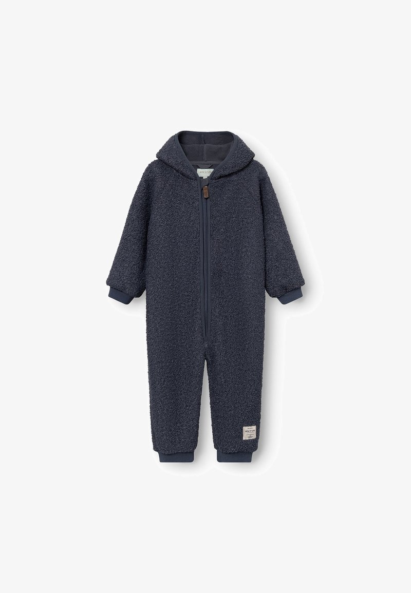 Marineblauwe fleece jumpsuit met een capuchon, voorzien van een rits aan de voorkant en ribbelboorden. Zacht, gestructureerd stof met een klein label aan de onderrand.