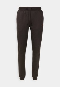 Black tapered sweatpants with elastic waistband, black-and-white drawstring, side pockets, and ribbed ankle cuffs.