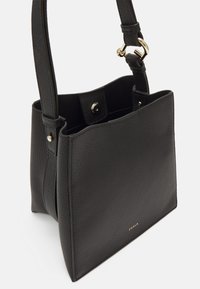 Black leather tote bag with a textured finish, rectangular shape, two handles, and gold hardware accents. Magnetic snap closure on top.
