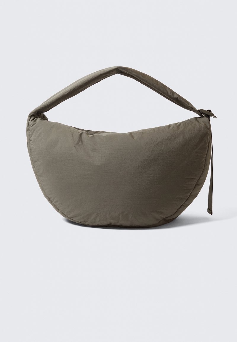 Hobo-style bag in olive green fabric with a smooth, slightly crinkled texture. Features a wide, padded handle and a curved, soft shape.