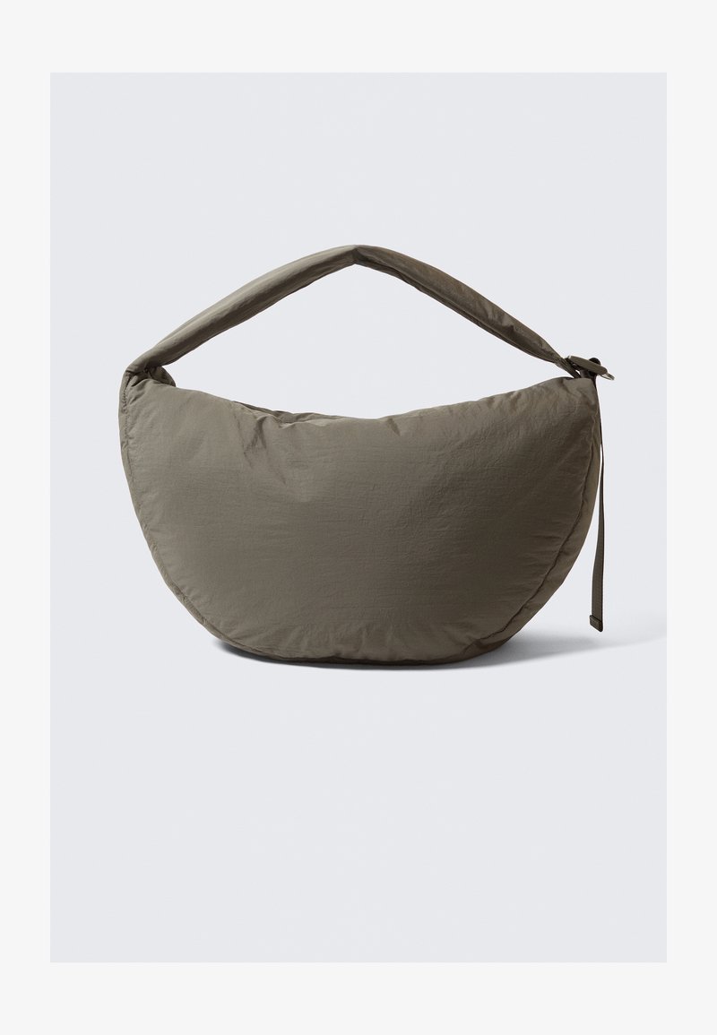 Hobo-style bag in olive green fabric with a smooth, slightly crinkled texture. Features a wide, padded handle and a curved, soft shape.