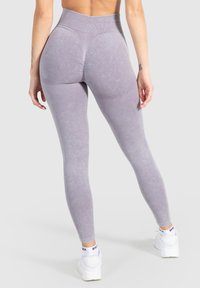 Leggings a vita alta in morbido tessuto lavanda chiaro. Caratterizzati da una finitura testurizzata e un design aderente con vita a coste.