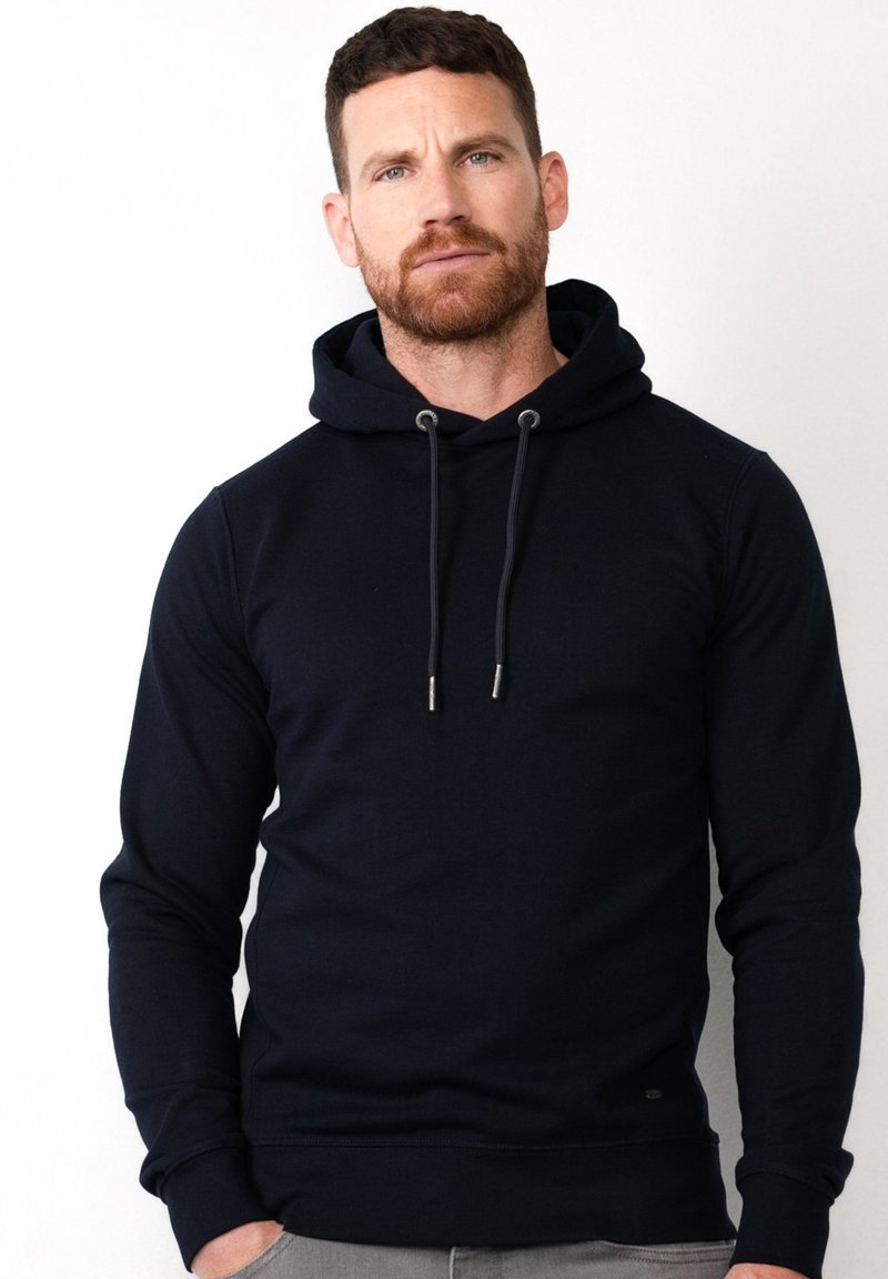 Sudadera de algodón azul marino con capucha ajustable, acentos metálicos, puños y dobladillo acanalados. Diseño de corte slim con una textura suave.