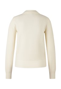 Cream-colored sweater, ribbed texture, long sleeves, collared neckline, solid design, mid-length, fitted at the waist, no visible logos or patterns.