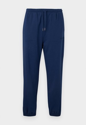 Pantaloni da jogging blu navy con vita elasticizzata, coulisse, tasche applicate frontali e polsini elasticizzati alle caviglie.