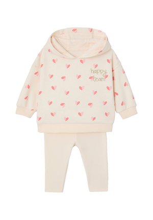 Cream toddler hooded sweatshirt with pink hearts and "happy team" text paired with cream ribbed leggings.