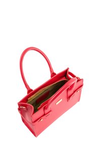 Red leather handbag with a structured shape, two handles, and an open top revealing an interior with a fabric lining and logo detail.