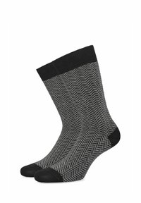 Skarpetki w wzór rybiej ości w kolorze czarnym i szarym. Miękka tkanina z kontrastującymi czarnymi ściągaczami i palcami.