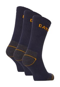 Chaussettes en coton marine foncé avec une texture côtelée. Couture jaune contrastante et sections de talon et d'orteil renforcées grises. Ensemble de trois paires.