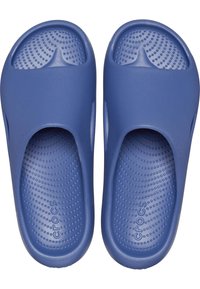 Blue rubber slide sandals with a smooth surface, rounded toe, open heel design, and textured insole featuring small dots and waves.