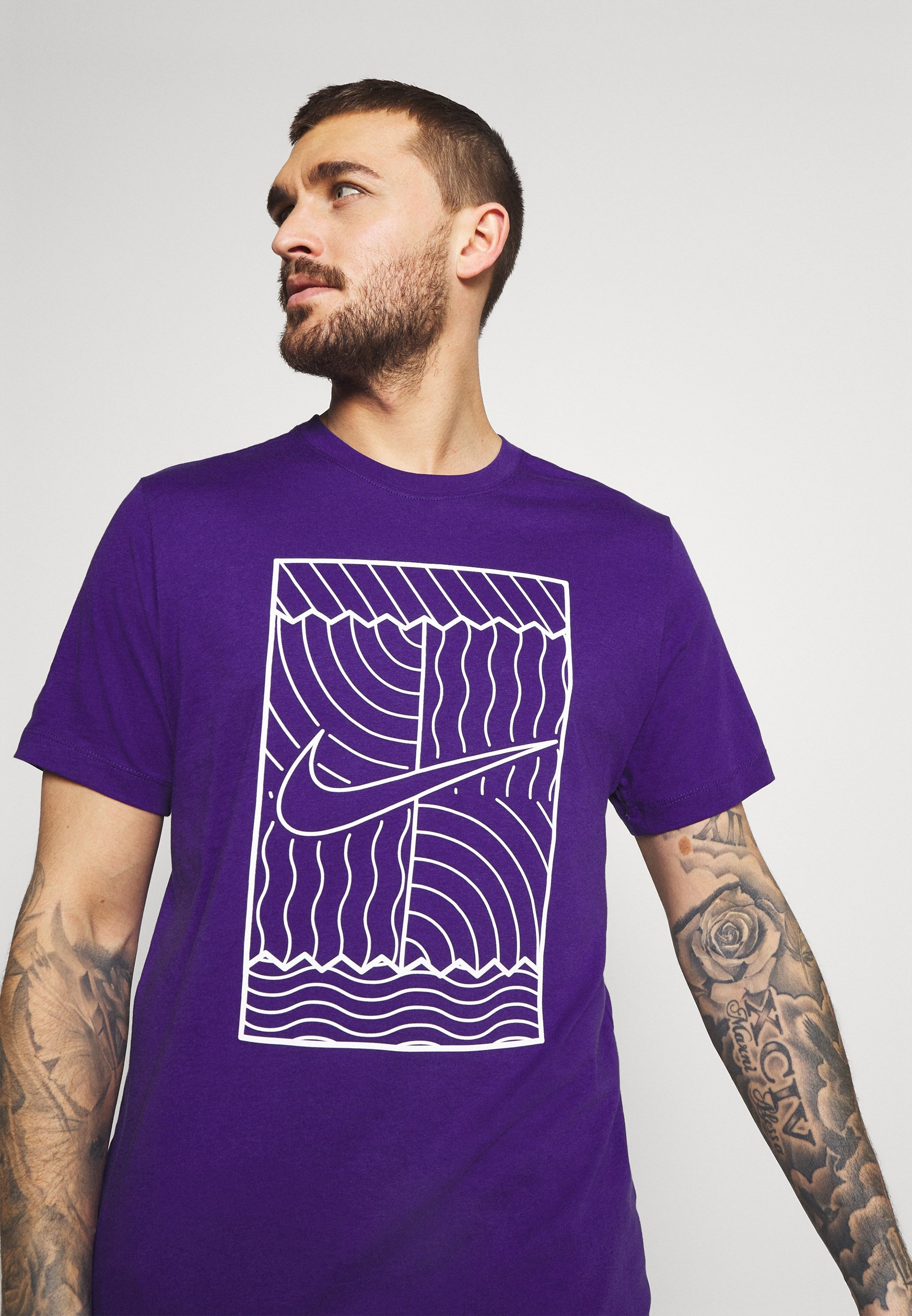 purple and turquoise nike shirt