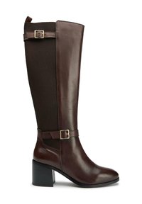 Brown leather knee-high boot with elastic side panels, block heel, and adjustable strap with buckle detail. Smooth finish and structured design.